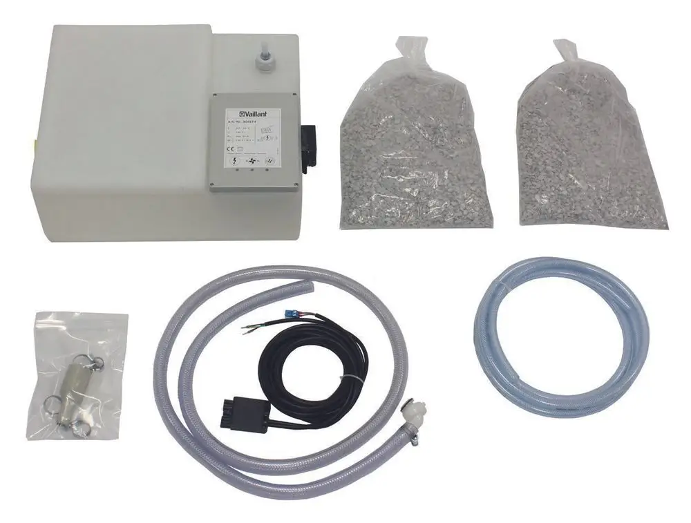 Vaillant Neutralisationseinrichtung mit Kondenswasserförderpumpe, bestehend aus einer Pumpe, Schläuchen und zwei Beuteln mit Granulat, geliefert in einem kompakten Gehäuse.
